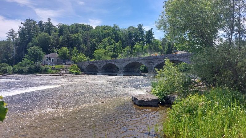 The Five Span stone bridge over the Mississippi River in Pakenham, in summer